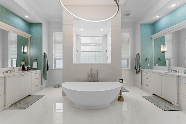 bathroom with vanity, ornamental molding, and a washtub