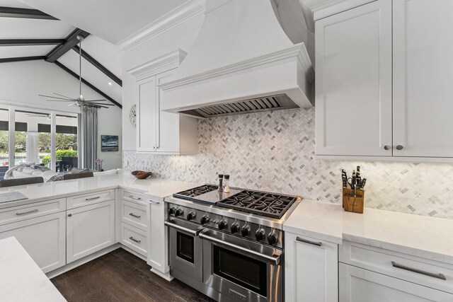 13209 Rolling Green Rd, North Palm Beach, FL 33408 - kitchen with double oven range, custom range hood, dark wood-style flooring, a ceiling fan, and backsplash