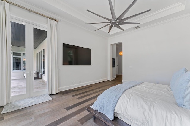 bedroom with french doors, dark hardwood / wood-style floors, crown molding, and ceiling fan