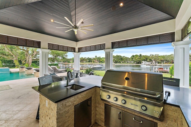 13209 Rolling Green Rd, North Palm Beach, FL 33408 - view of patio / terrace with area for grilling, a sink, a grill, and a water view