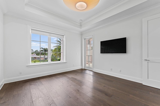 unfurnished living room with crown molding, a raised ceiling, and dark hardwood / wood-style flooring