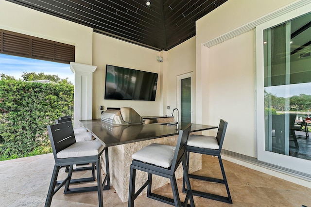 view of patio / terrace with sink, exterior kitchen, and area for grilling