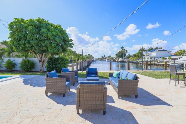 view of patio with outdoor lounge area and a water view