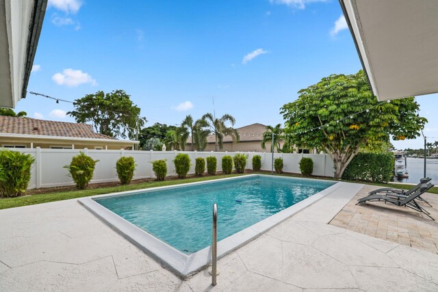 view of pool featuring a patio area