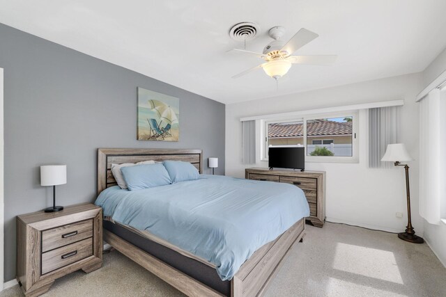 bedroom featuring ceiling fan and light carpet