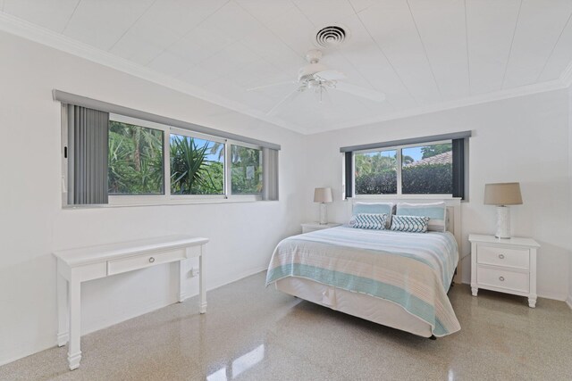 bedroom with ceiling fan and crown molding