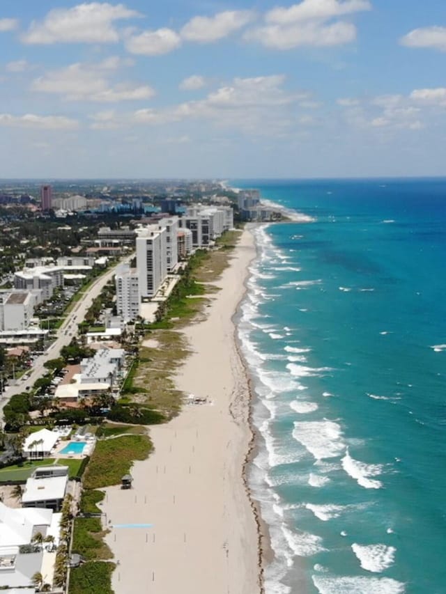 aerial view with a beach view and a water view