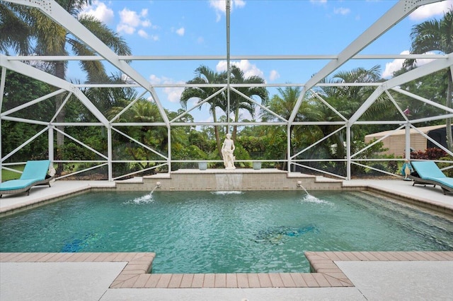 view of pool featuring a patio area, a lanai, and pool water feature