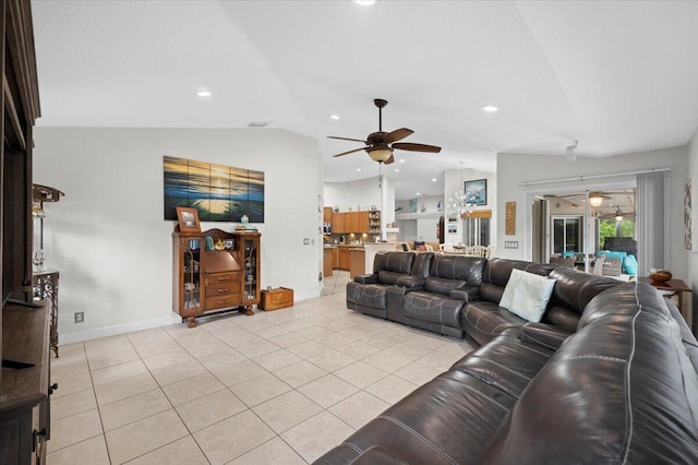 tiled living room featuring ceiling fan and lofted ceiling