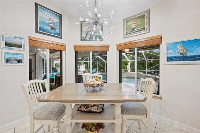 dining room featuring a notable chandelier and light tile patterned flooring