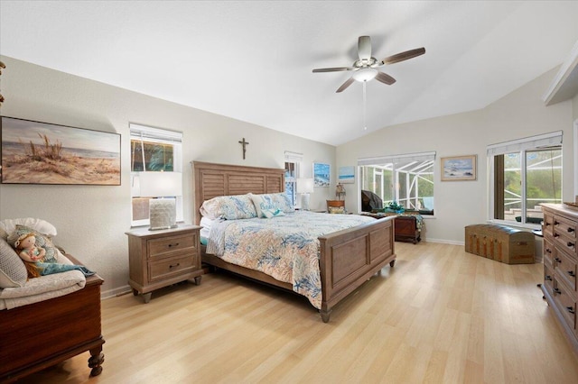 bedroom with ceiling fan, vaulted ceiling, and light wood-type flooring