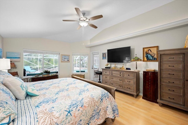 bedroom with ceiling fan, light wood-type flooring, and vaulted ceiling