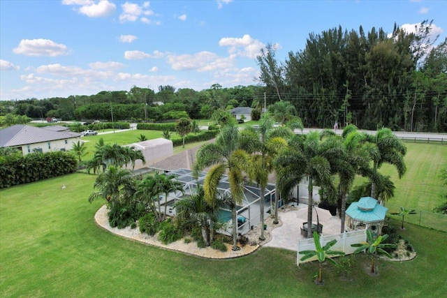 exterior space featuring a lanai and a yard