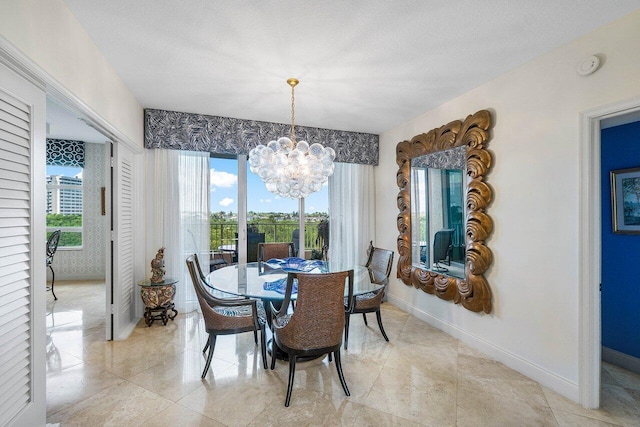 tiled dining area featuring an inviting chandelier