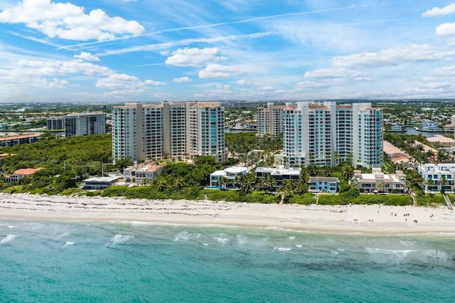 birds eye view of property featuring a view of the beach and a water view