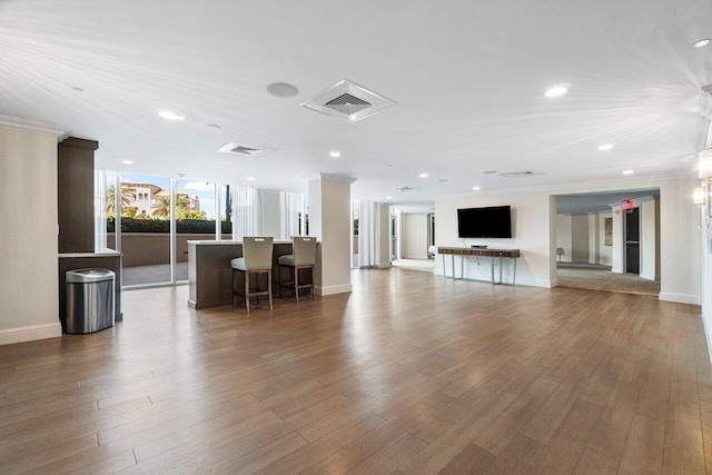 unfurnished living room featuring wood-type flooring