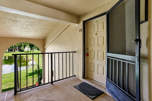 doorway to property featuring a balcony