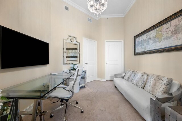 carpeted office space with a towering ceiling, an inviting chandelier, and ornamental molding