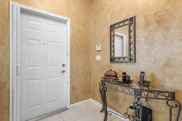 entryway featuring light tile patterned floors