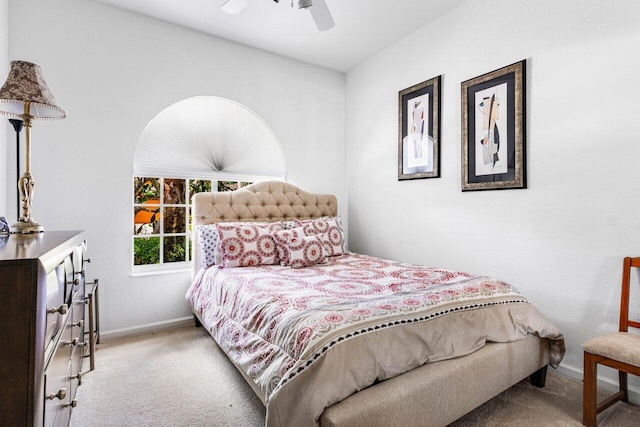 bedroom featuring light carpet and ceiling fan