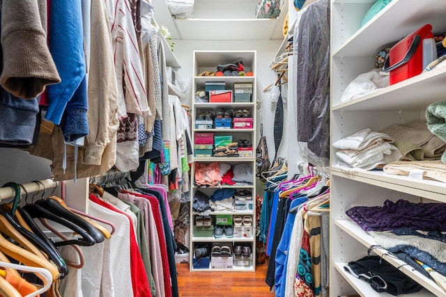 spacious closet featuring hardwood / wood-style floors