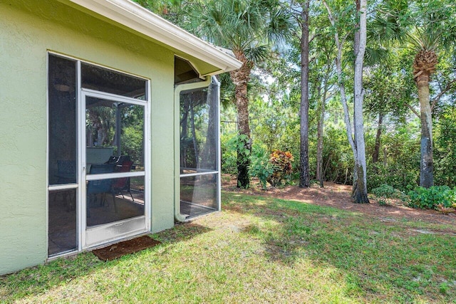 view of yard with a sunroom