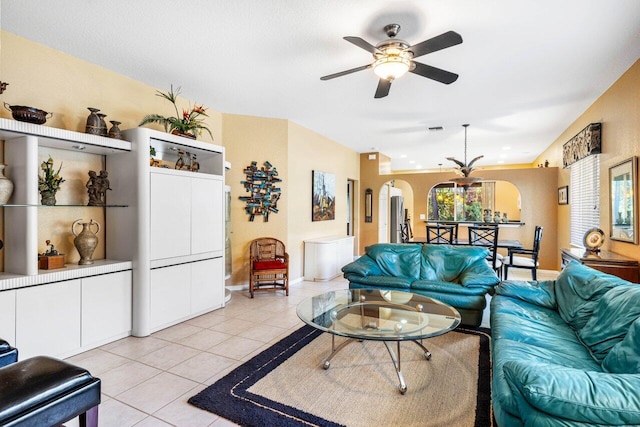 tiled living room with ceiling fan