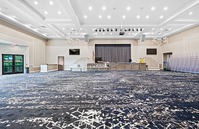 interior space featuring coffered ceiling, carpet, beamed ceiling, and ornamental molding