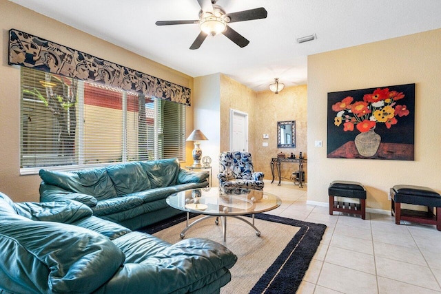 tiled living room featuring ceiling fan and a wealth of natural light