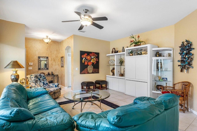 living room with ceiling fan and light tile patterned floors