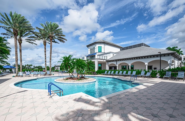 view of swimming pool featuring a patio area