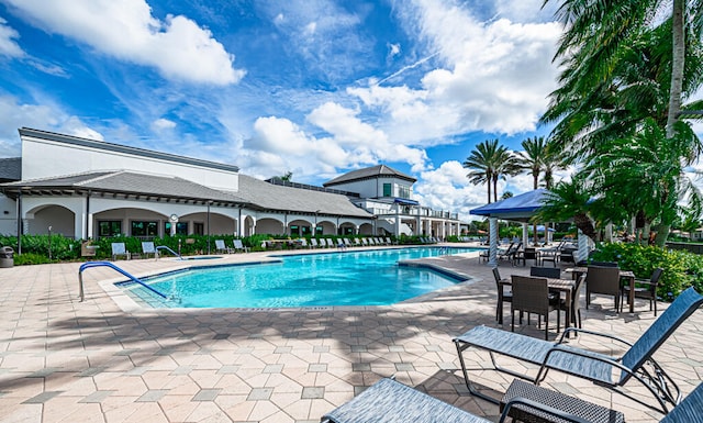 view of swimming pool featuring a patio area