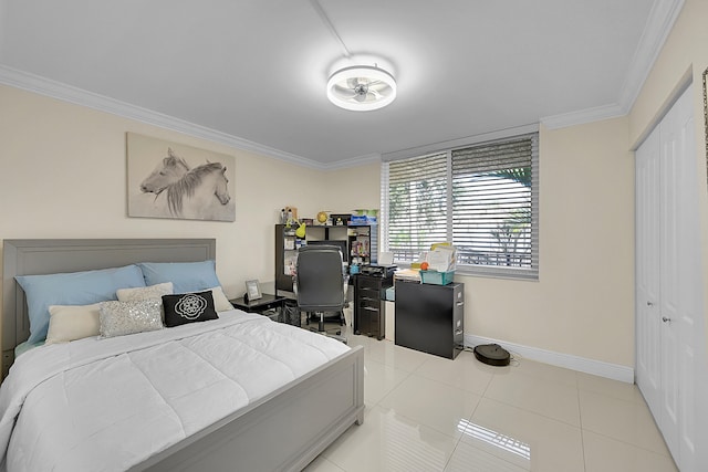 bedroom featuring a closet, ornamental molding, and light tile patterned floors