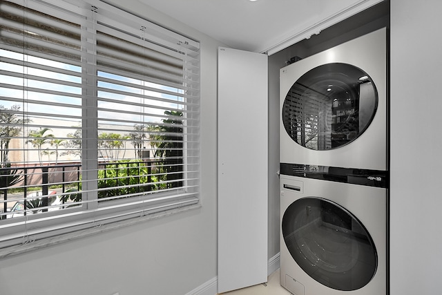 washroom with stacked washer / drying machine