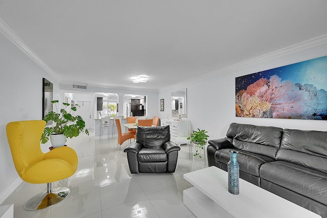 living room with crown molding and light tile patterned floors