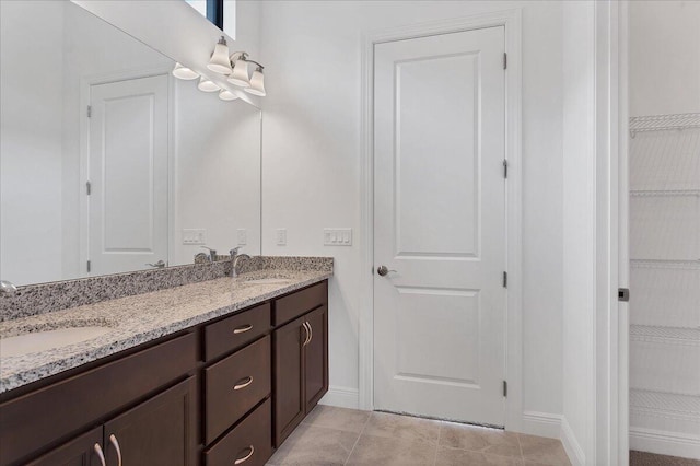 bathroom with tile patterned floors and vanity