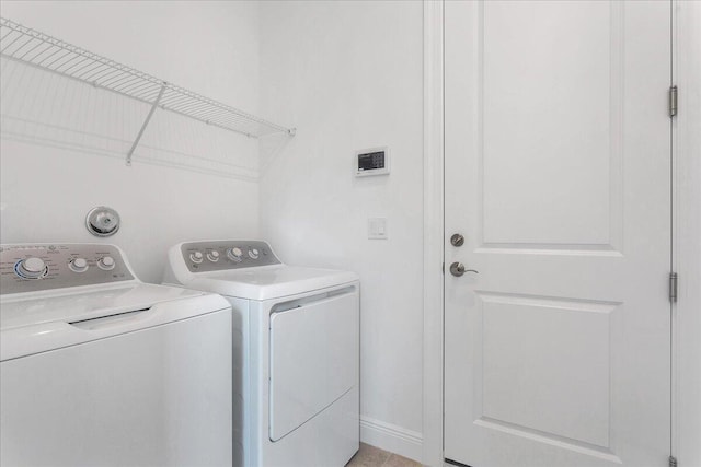 laundry area featuring independent washer and dryer