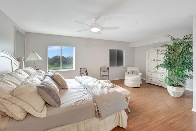 bedroom featuring ceiling fan and light hardwood / wood-style flooring