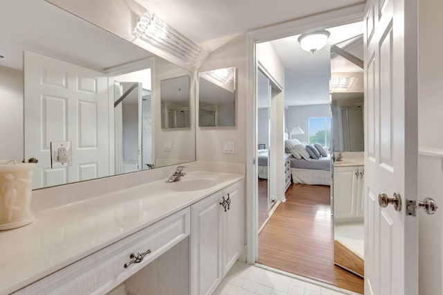 bathroom featuring vanity and hardwood / wood-style flooring