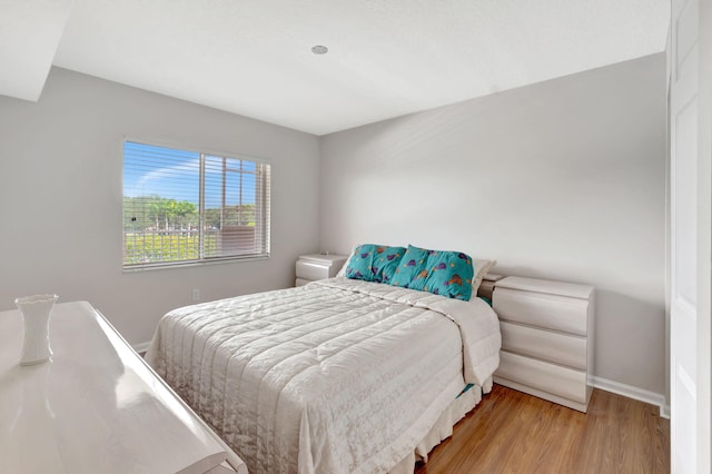 bedroom with light wood-type flooring