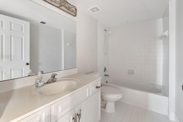 full bathroom featuring tile patterned flooring, vanity, toilet, and tiled shower / bath