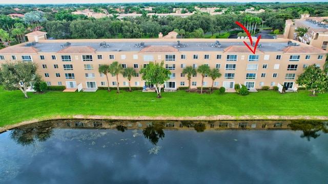 birds eye view of property with a water view