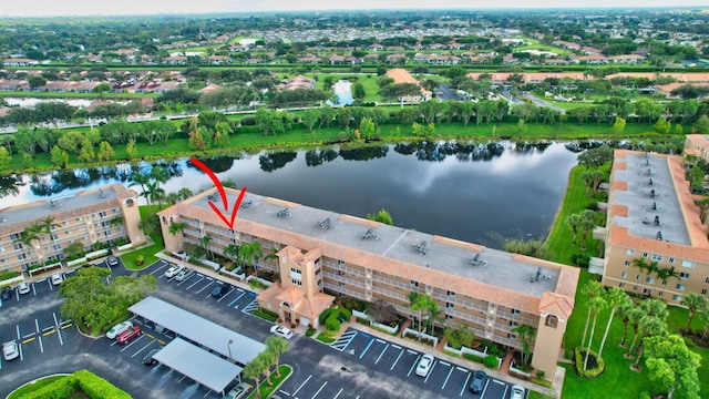 birds eye view of property featuring a water view