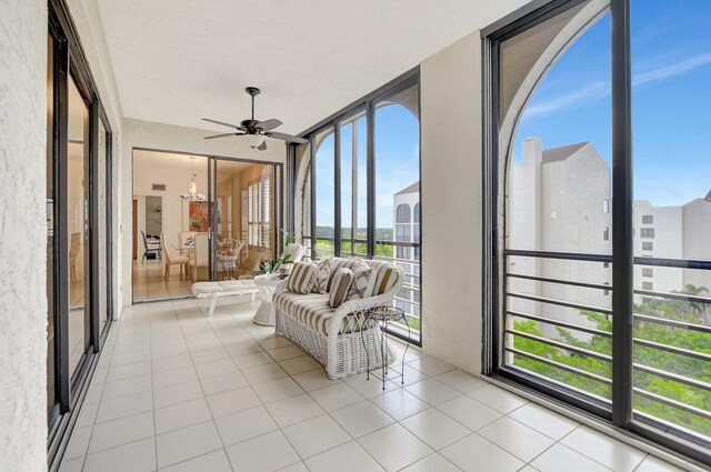 sunroom with a ceiling fan