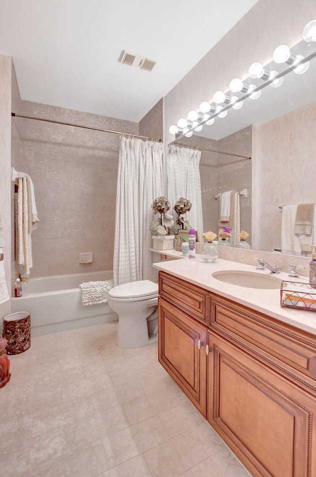 full bathroom featuring visible vents, vanity, toilet, and shower / bath combo with shower curtain