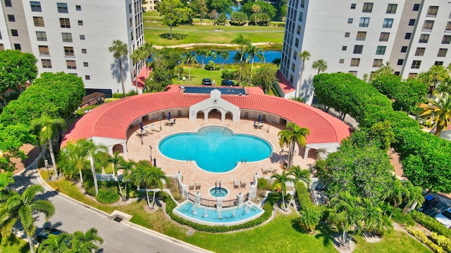 view of swimming pool with a water view