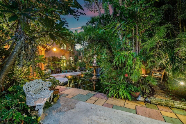 view of patio terrace at dusk