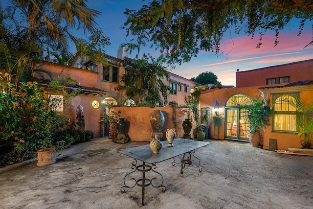 view of patio terrace at dusk