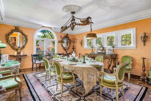 dining area with ornamental molding