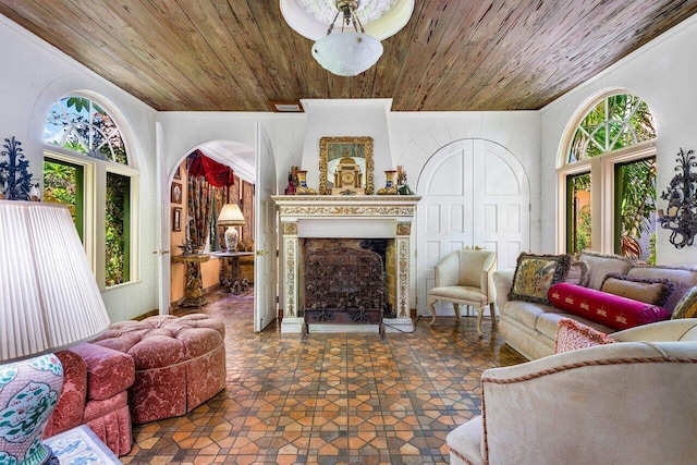 tiled living room featuring wooden ceiling